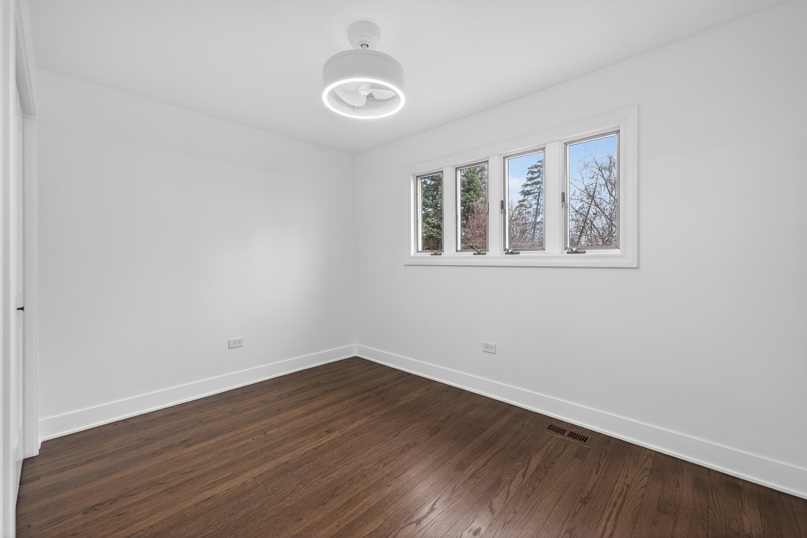 241 East Schick Road Bloomingdale, IL 60108 - Photo 18 of 30 a view of a room with wooden floor and windows