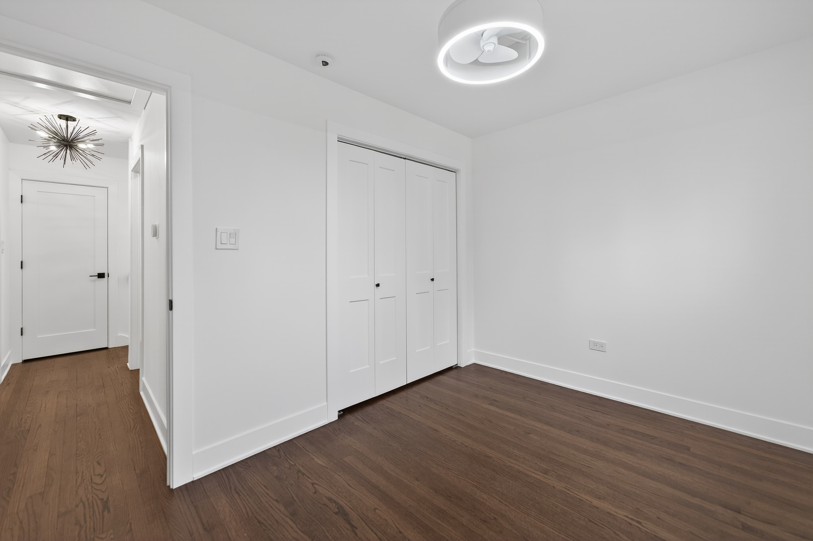 241 East Schick Road Bloomingdale, IL 60108 - Photo 19 of 30 a view of a room with wooden floor