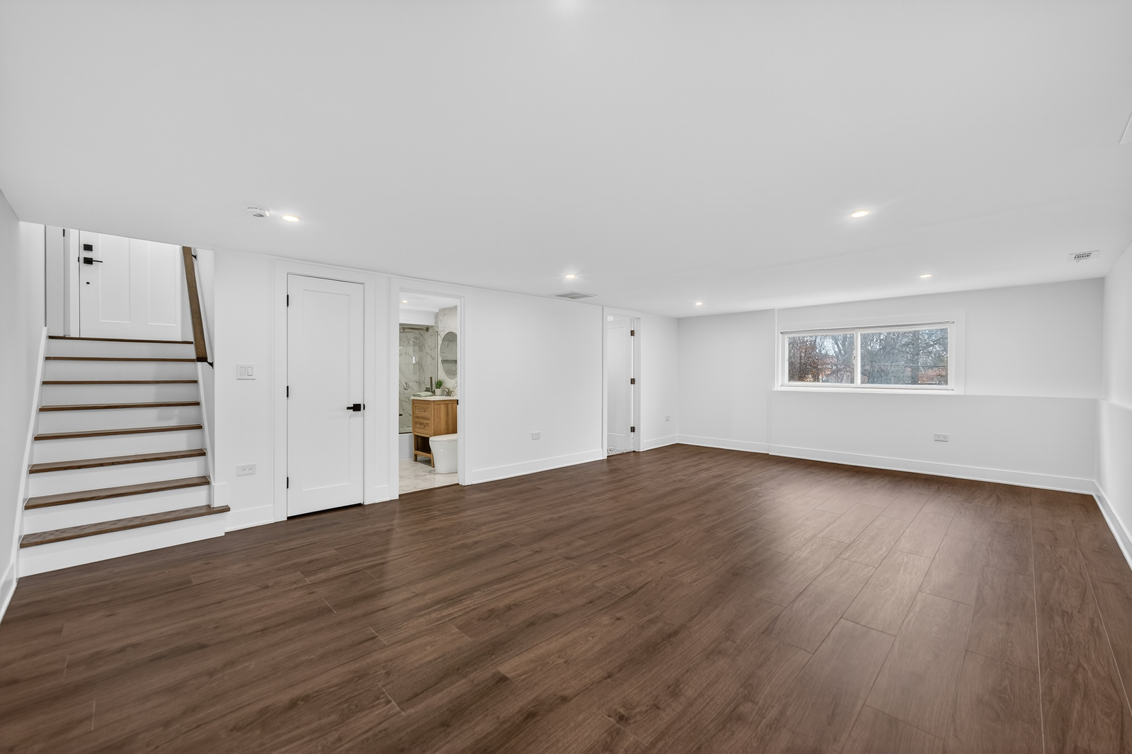241 East Schick Road Bloomingdale, IL 60108 - Photo 22 of 30 a view of a room with wooden floors and white walls