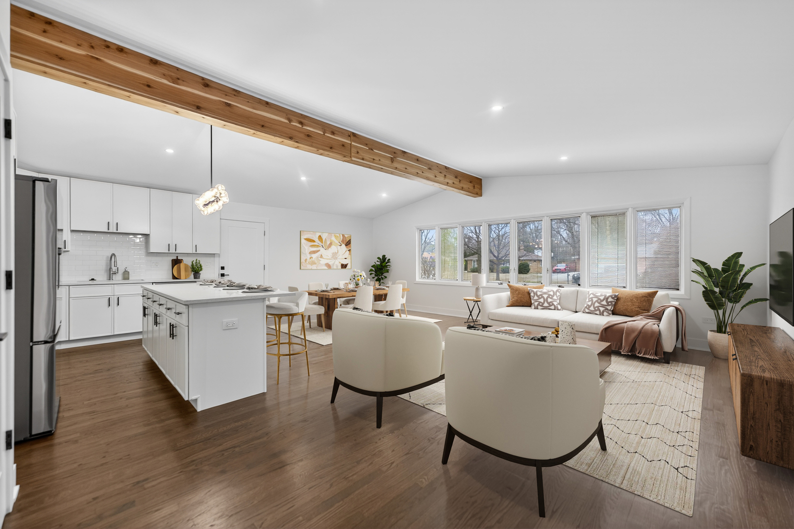 241 East Schick Road Bloomingdale, IL 60108 - Photo 4 of 30 a living room with furniture kitchen view and a wooden floor