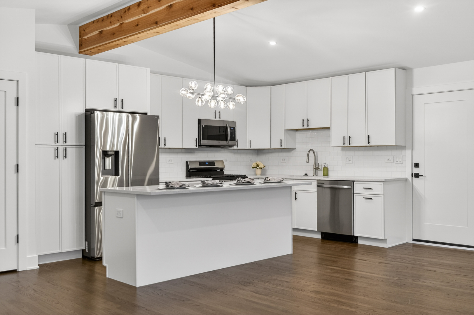 241 East Schick Road Bloomingdale, IL 60108 - Photo 9 of 30 a kitchen with stainless steel appliances a refrigerator sink and microwave