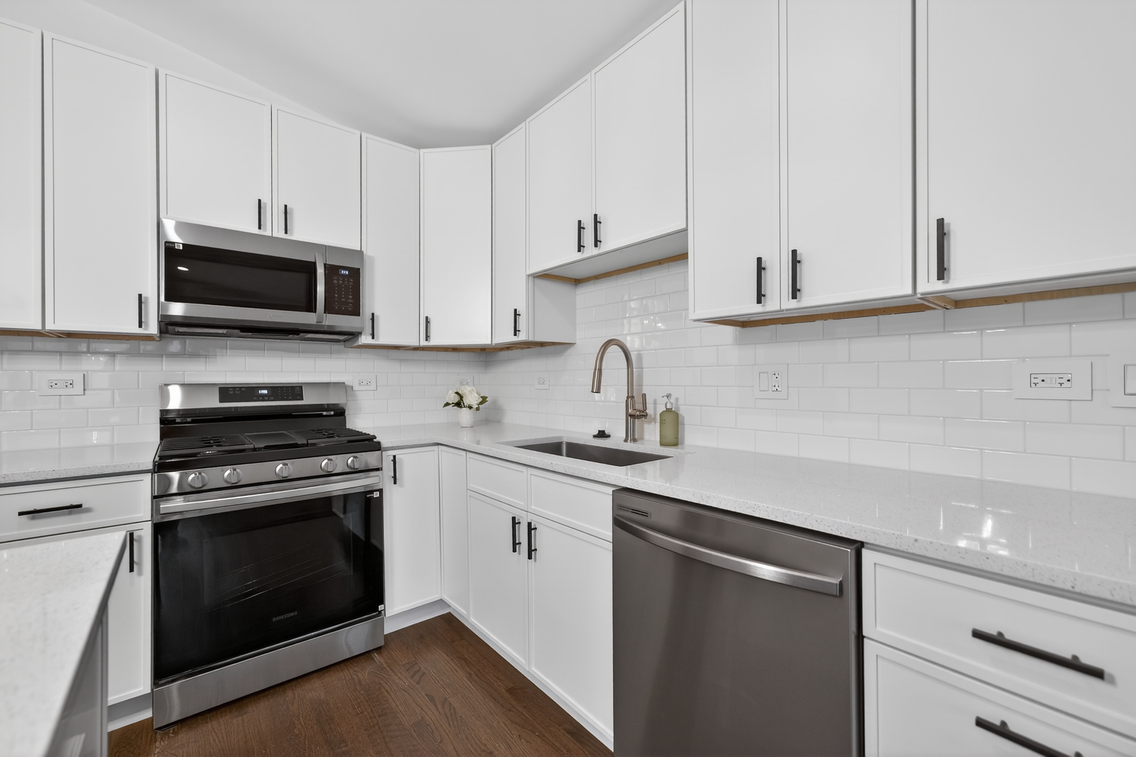 241 East Schick Road Bloomingdale, IL 60108 - Photo 10 of 30 a kitchen with stainless steel appliances granite countertop grey cabinets a stove a sink and dishwasher