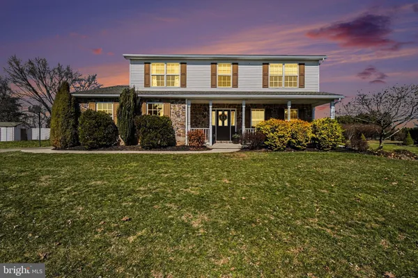 a view of a building with a yard