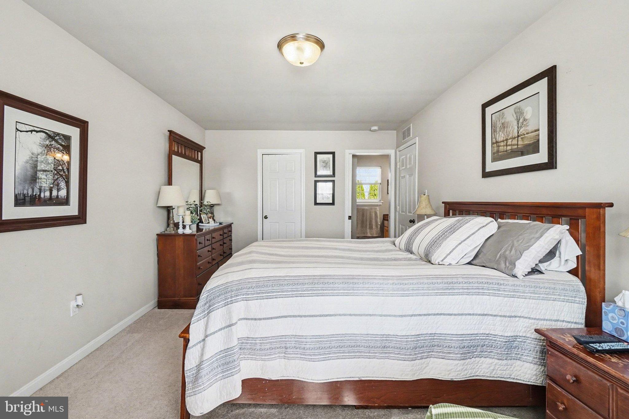 44 Oak Avenue Halifax, PA 17032 - Photo 17 of 33 a bedroom with a bed and a chandelier