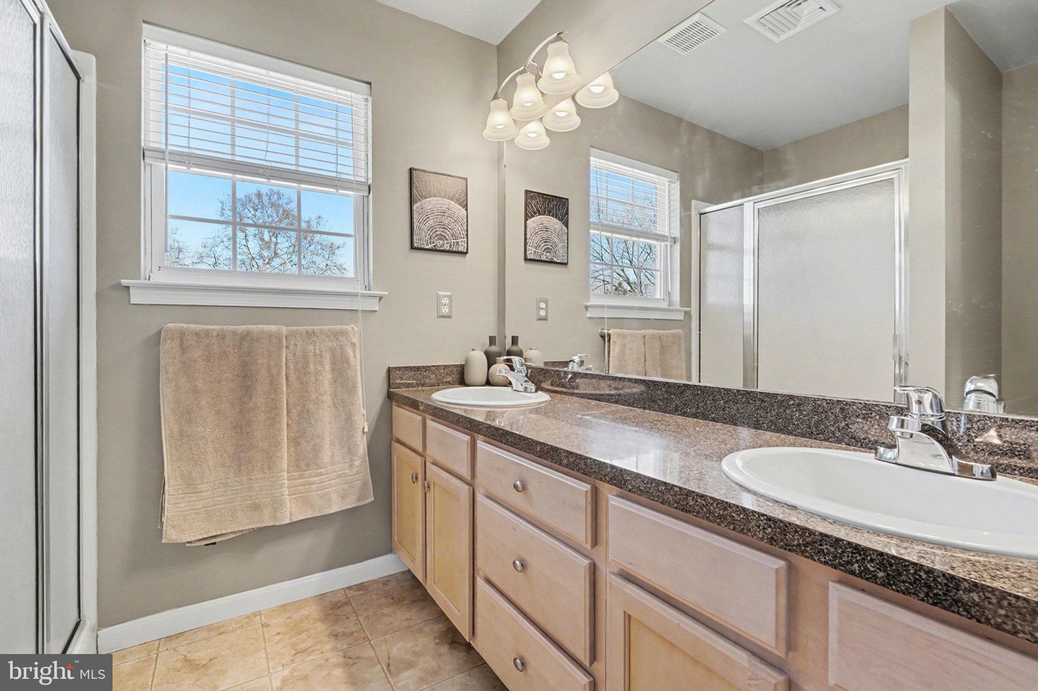 44 Oak Avenue Halifax, PA 17032 - Photo 18 of 33 a bathroom with double sink and a mirror
