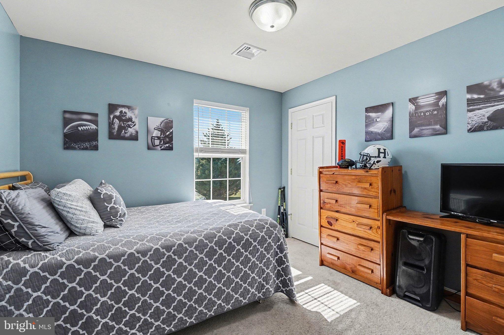 44 Oak Avenue Halifax, PA 17032 - Photo 21 of 33 a bedroom with a bed and a television