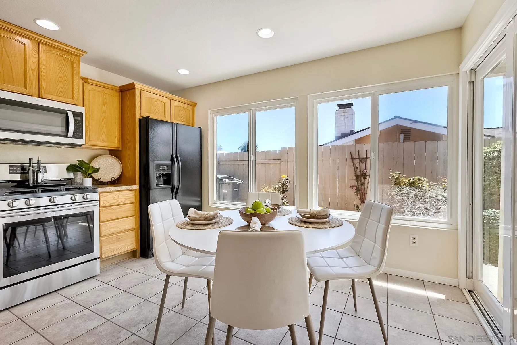 13440 Montego Drive Poway, CA 92064 - Photo 11 of 35 a view of a dining room with furniture a chandelier and wooden floor