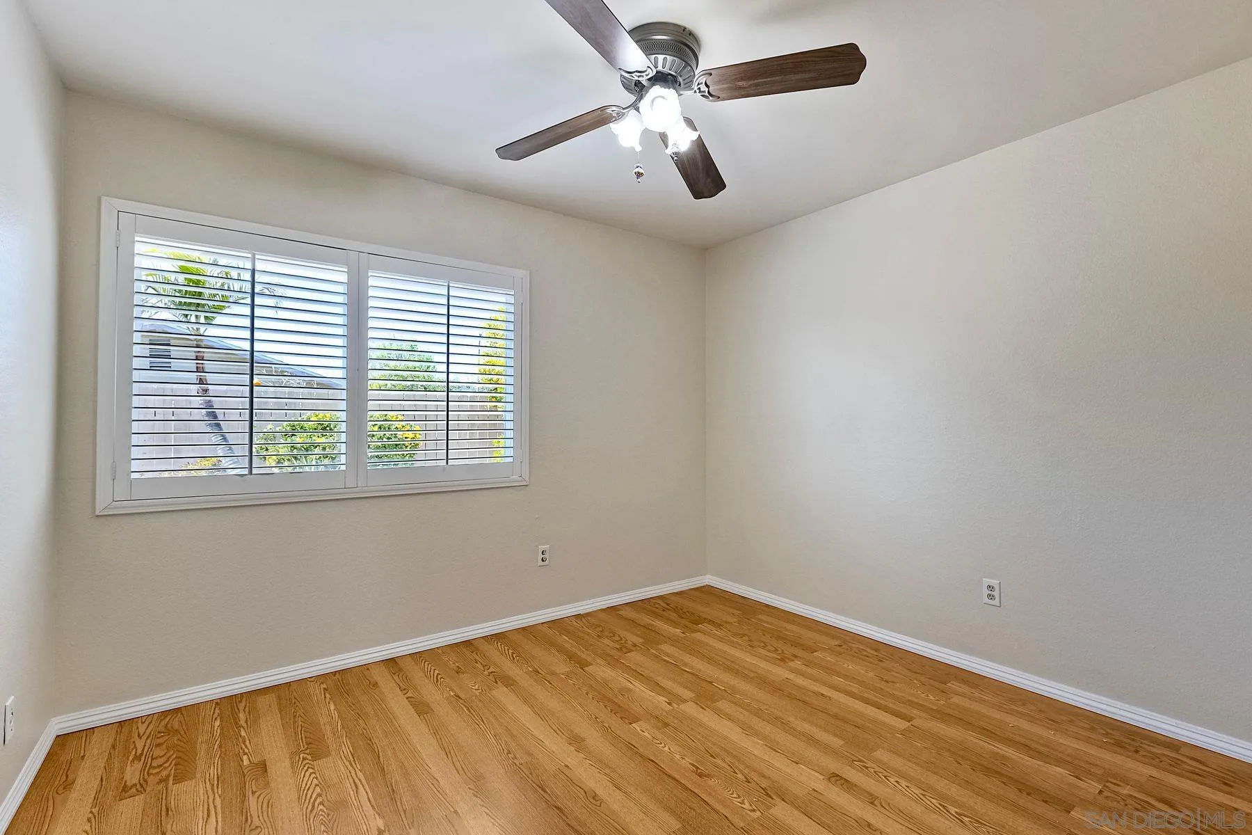 13440 Montego Drive Poway, CA 92064 - Photo 17 of 35 a view of empty room with wooden floor and fan
