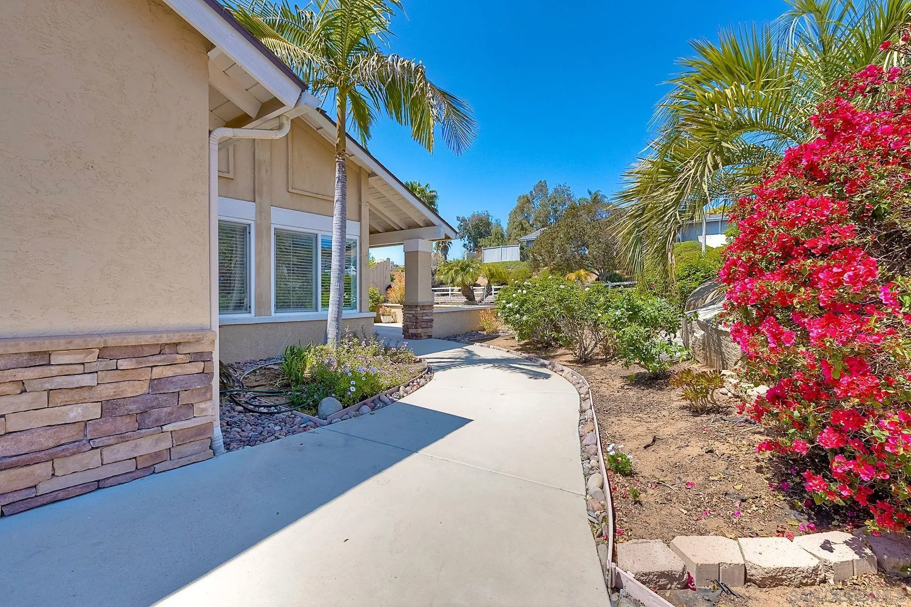 13440 Montego Drive Poway, CA 92064 - Photo 34 of 35 a view of a house with a yard and garden