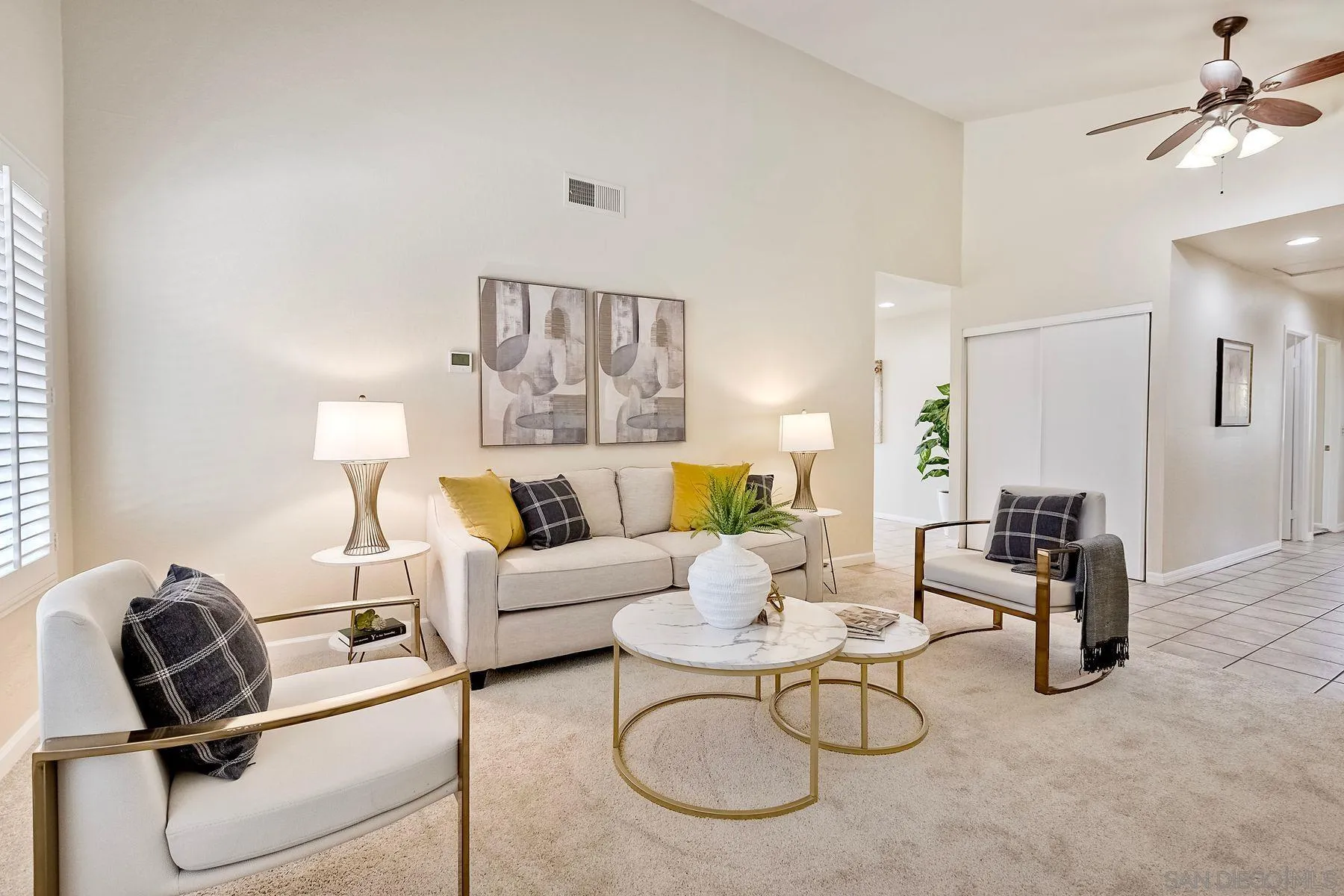 13440 Montego Drive Poway, CA 92064 - Photo 4 of 35 a living room with furniture a rug potted plant and a window