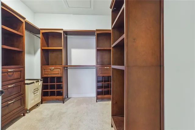 a bedroom with a bed and a chair