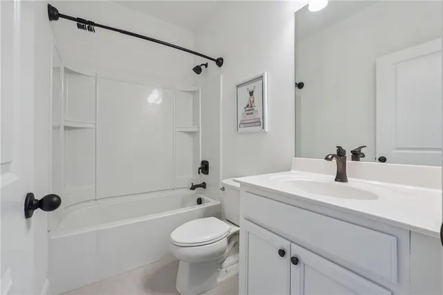 a bedroom with a bed and a desk