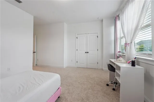 a bedroom with furniture and a chandelier