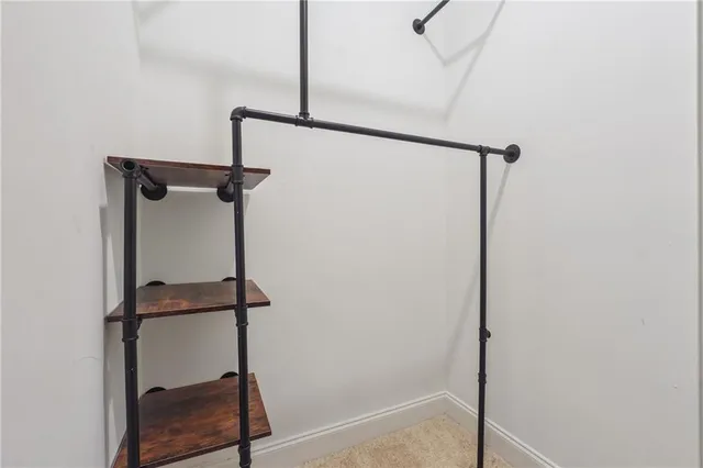 a view of a balcony with chairs and a table