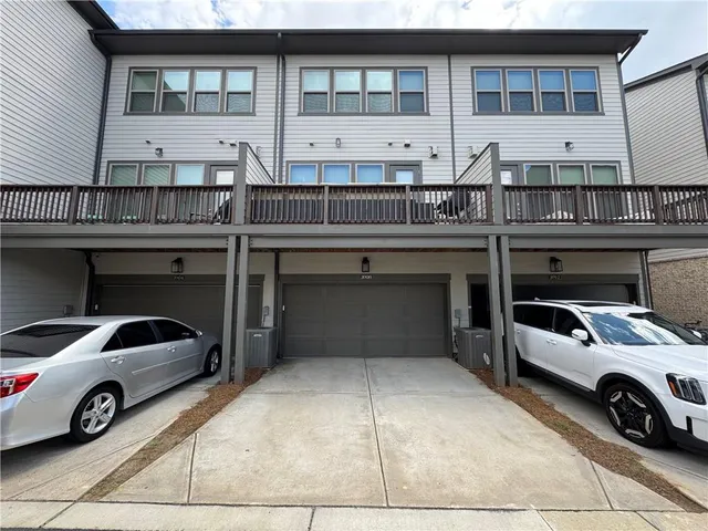 a view of a patio with table and chairs and potted plants