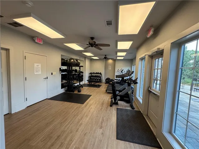 a view of a patio with table and chairs and potted plants