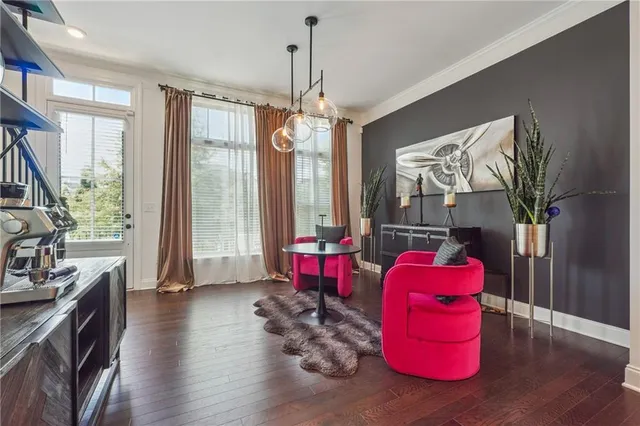 an open kitchen with white cabinets and stainless steel appliances