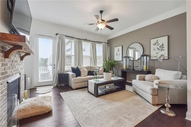 a living room with furniture fireplace and flat screen tv