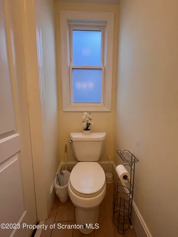 a bathroom with a toilet and a sink