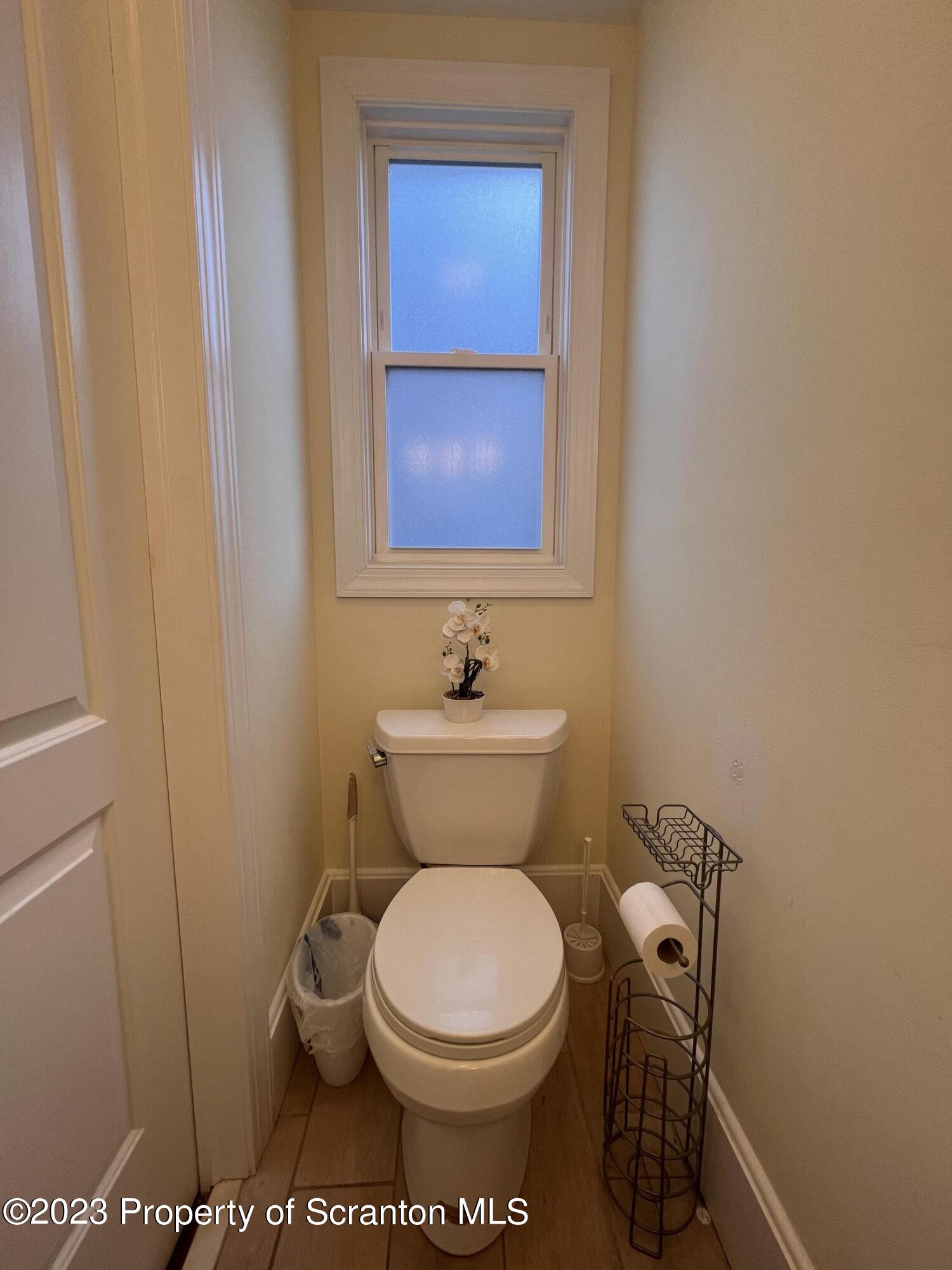 611 East Locust Street Scranton, PA 18505 - Photo 11 of 18 a bathroom with a toilet and a sink