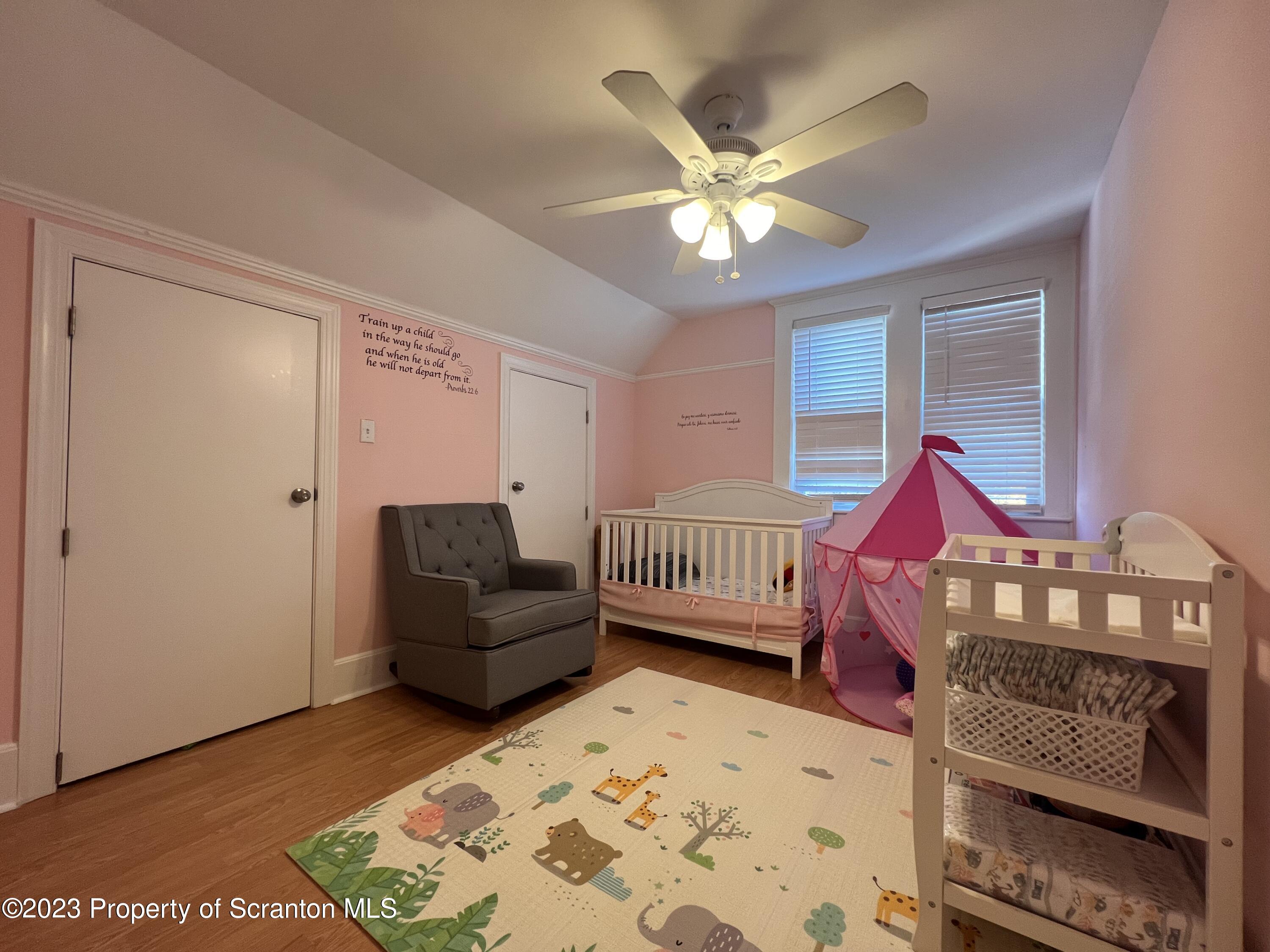611 East Locust Street Scranton, PA 18505 - Photo 13 of 18 a living room with a bed furniture and a window