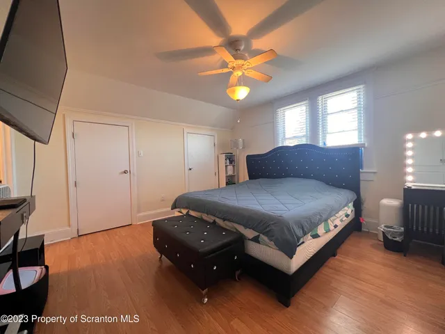 a bedroom with a bed and window