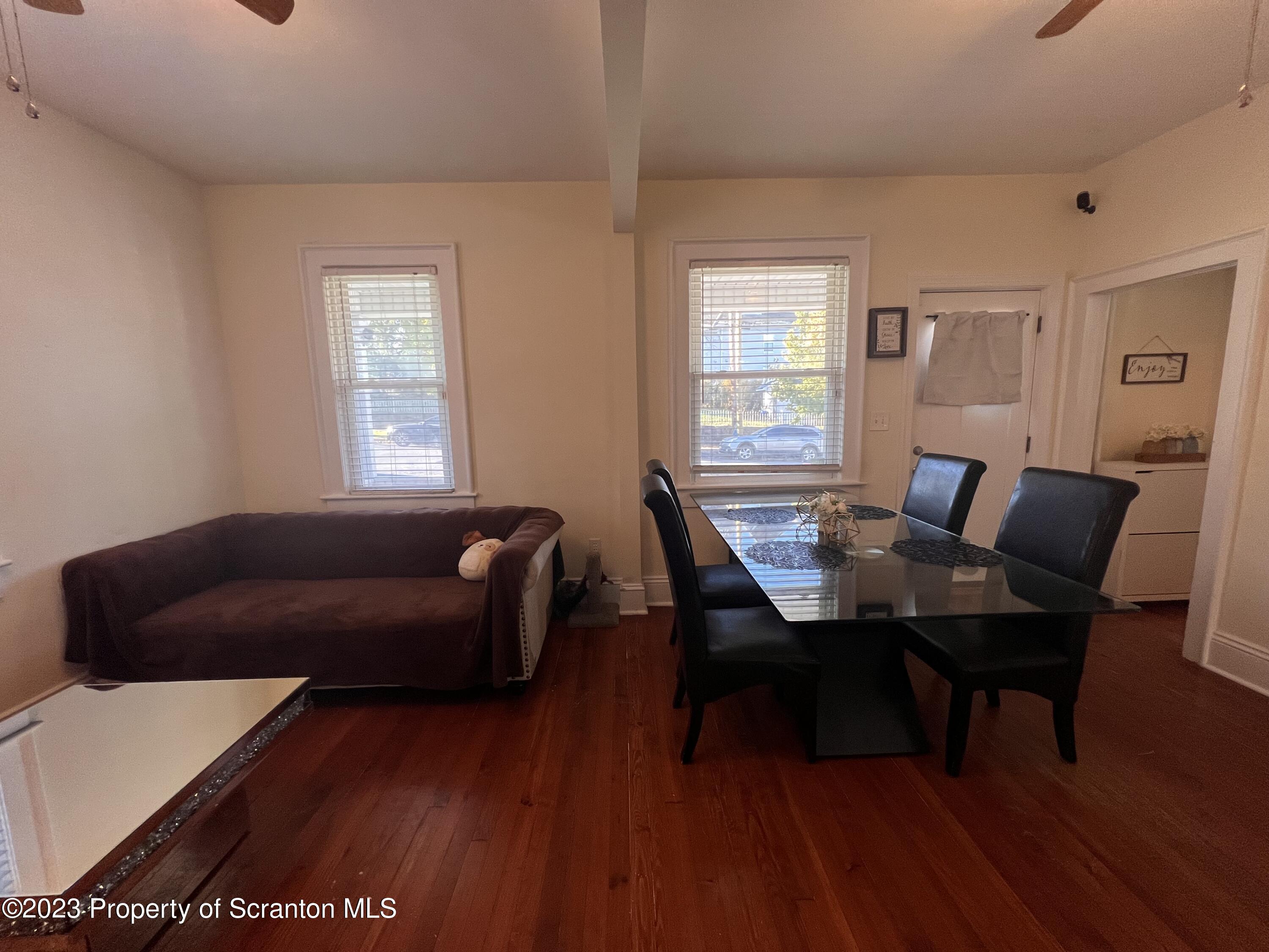 611 East Locust Street Scranton, PA 18505 - Photo 3 of 18 a work room with furniture wooden floor and a window