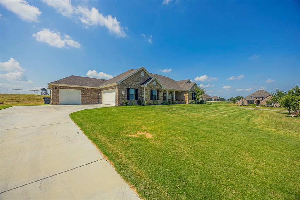 105 Kathy Stephens Avenue Springtown, TX 76082 - Photo 15 of 40 a view of a house with a yard