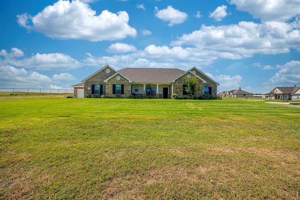 105 Kathy Stephens Avenue Springtown, TX 76082 - Photo 16 of 40 a view of a house with a yard