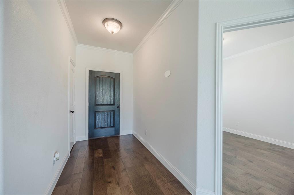 105 Kathy Stephens Avenue Springtown, TX 76082 - Photo 18 of 40 a view of hallway with wooden floor