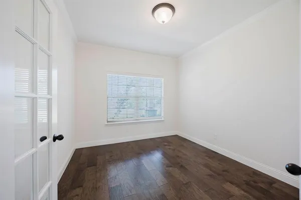 a view of a livingroom with wooden floor and a fireplace