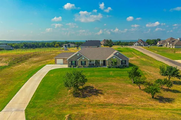 a view of a house with a big yard