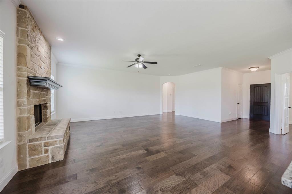 105 Kathy Stephens Avenue Springtown, TX 76082 - Photo 24 of 40 a view of a livingroom with a fireplace