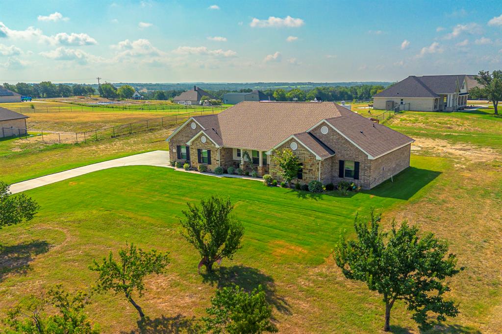 105 Kathy Stephens Avenue Springtown, TX 76082 - Photo 3 of 40 a view of a house with a ocean view