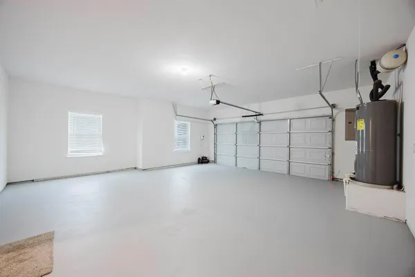 a view of an empty room and wooden floor