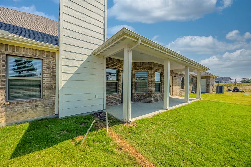 105 Kathy Stephens Avenue Springtown, TX 76082 - Photo 9 of 40 a view of a house with a yard