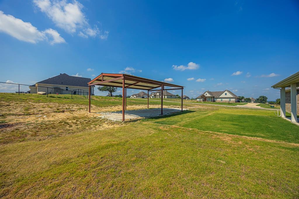 105 Kathy Stephens Avenue Springtown, TX 76082 - Photo 10 of 40 a view of swimming pool with lawn chairs and iron fence
