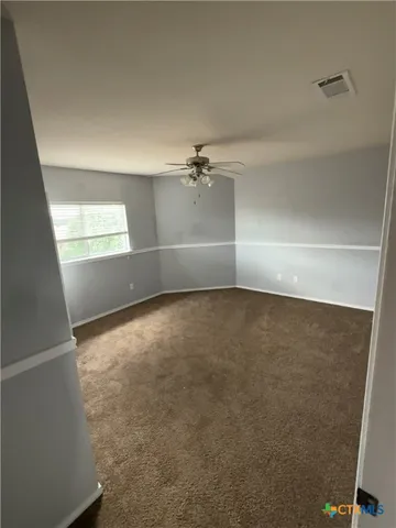 a bathroom with a sink a toilet a mirror and vanity