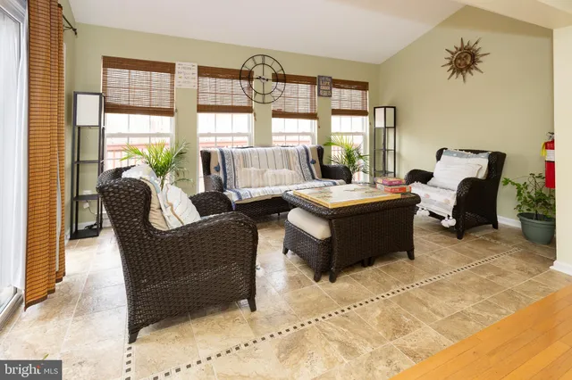 a living room with furniture window and a table