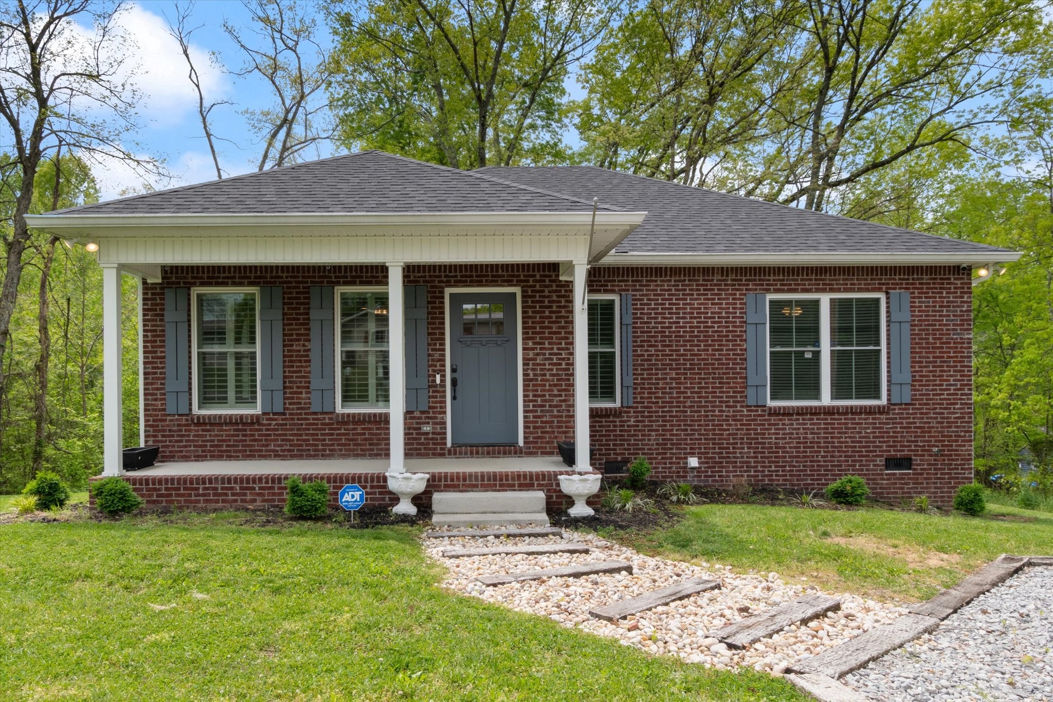 a view of front a house with a yard