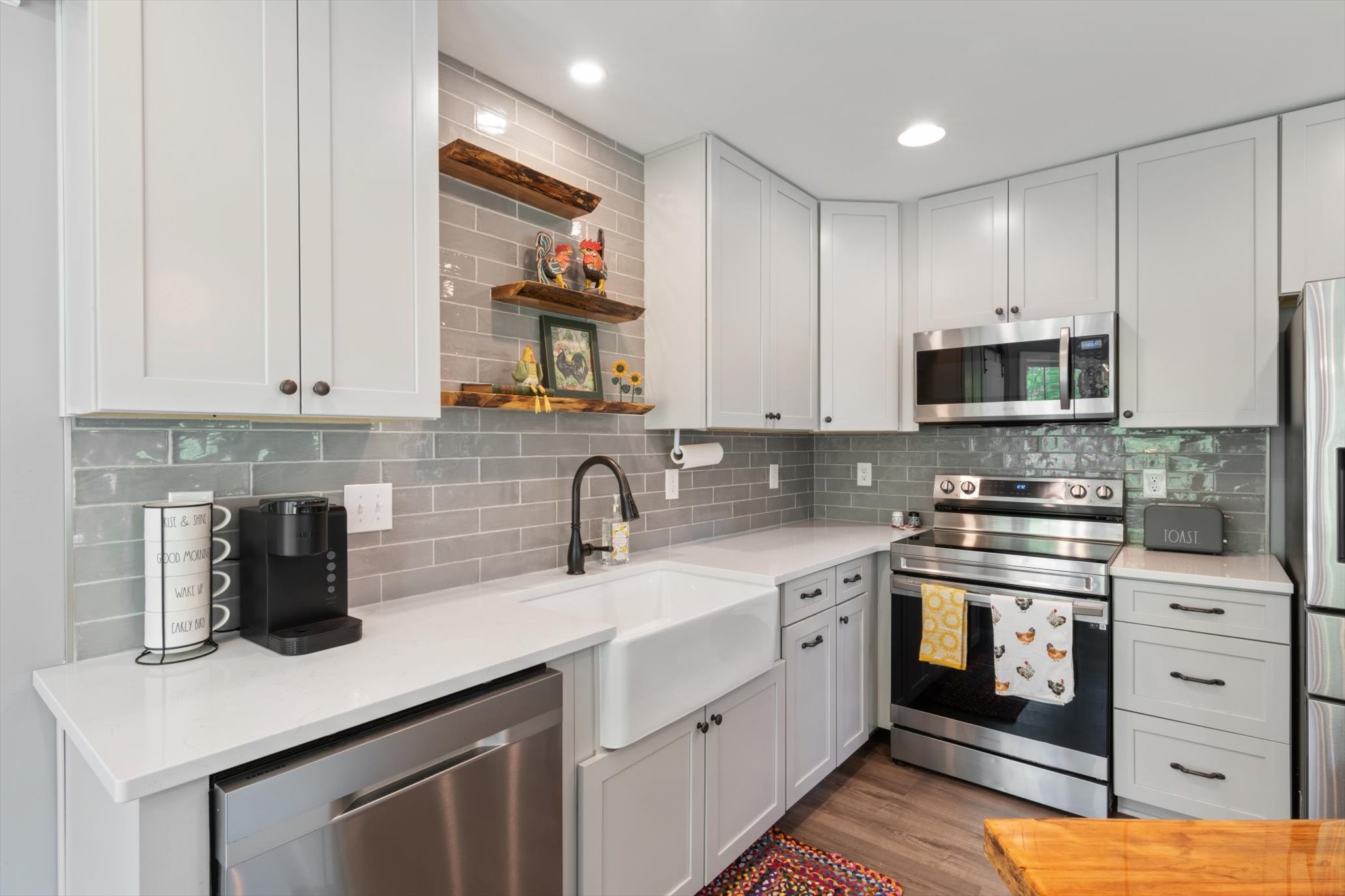 7452 South Swift Road Goodlettsville, TN 37072 - Photo 11 of 27 a kitchen with stainless steel appliances granite countertop a sink and a stove