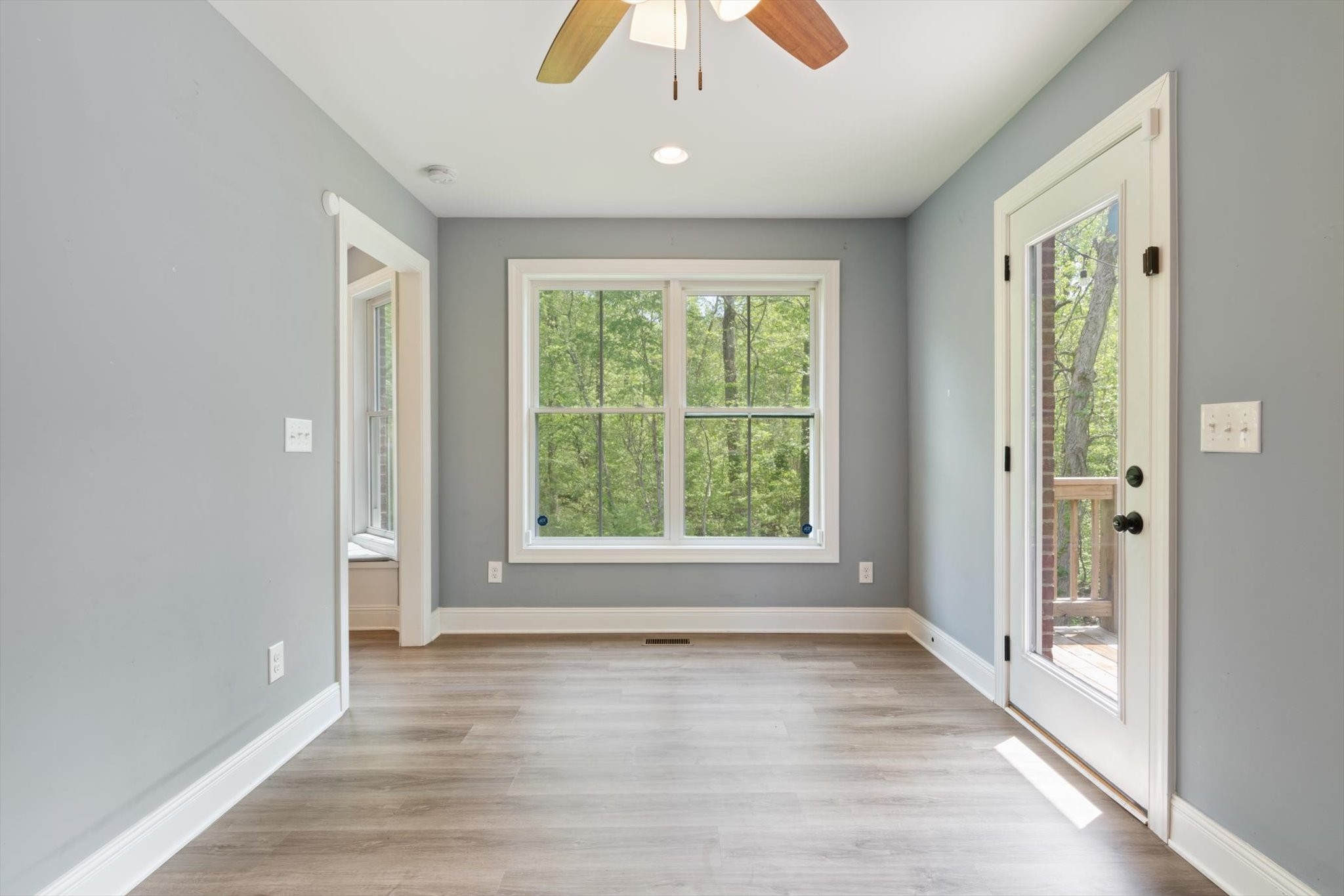 7452 South Swift Road Goodlettsville, TN 37072 - Photo 19 of 27 an empty room with wooden floor and windows