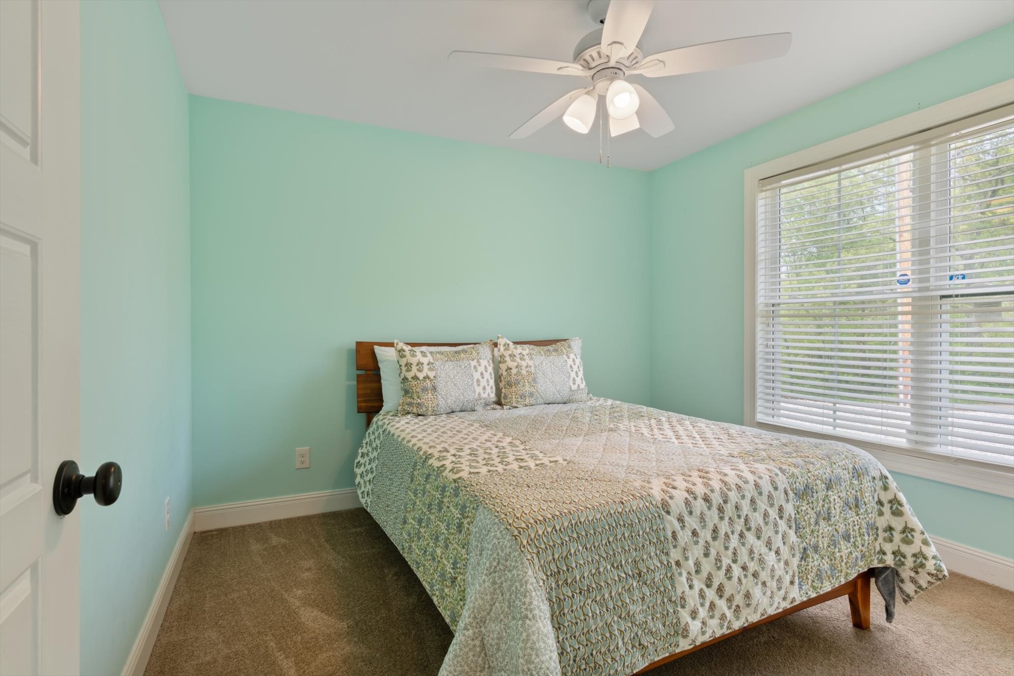 7452 South Swift Road Goodlettsville, TN 37072 - Photo 20 of 27 a bedroom with a bed and a chandelier