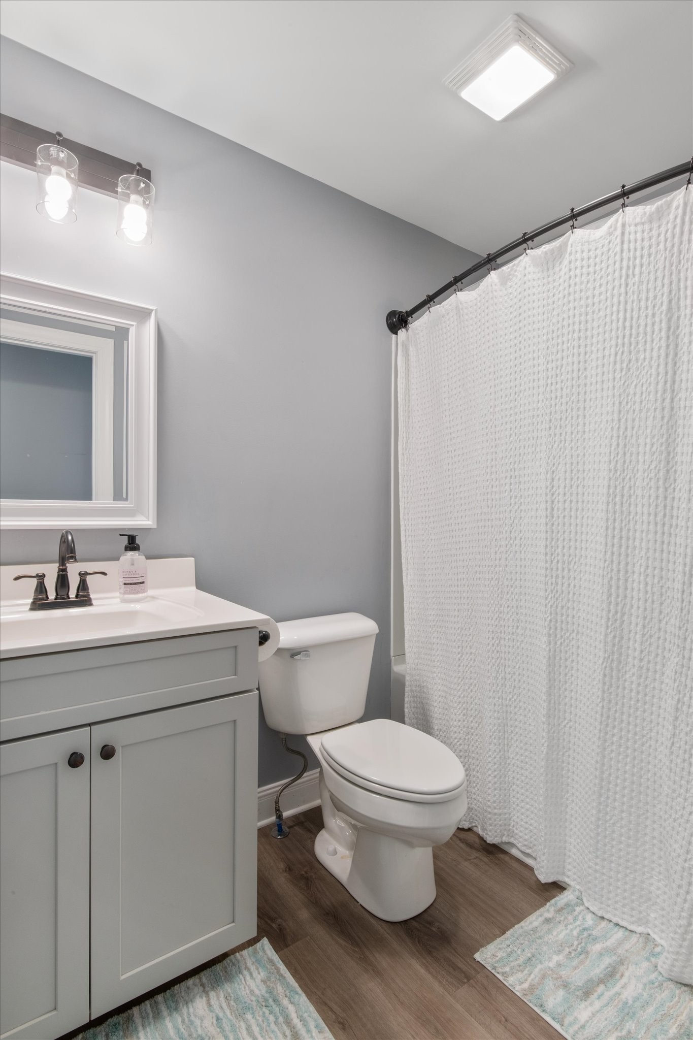 7452 South Swift Road Goodlettsville, TN 37072 - Photo 21 of 27 a bathroom with a granite countertop sink toilet and a mirror