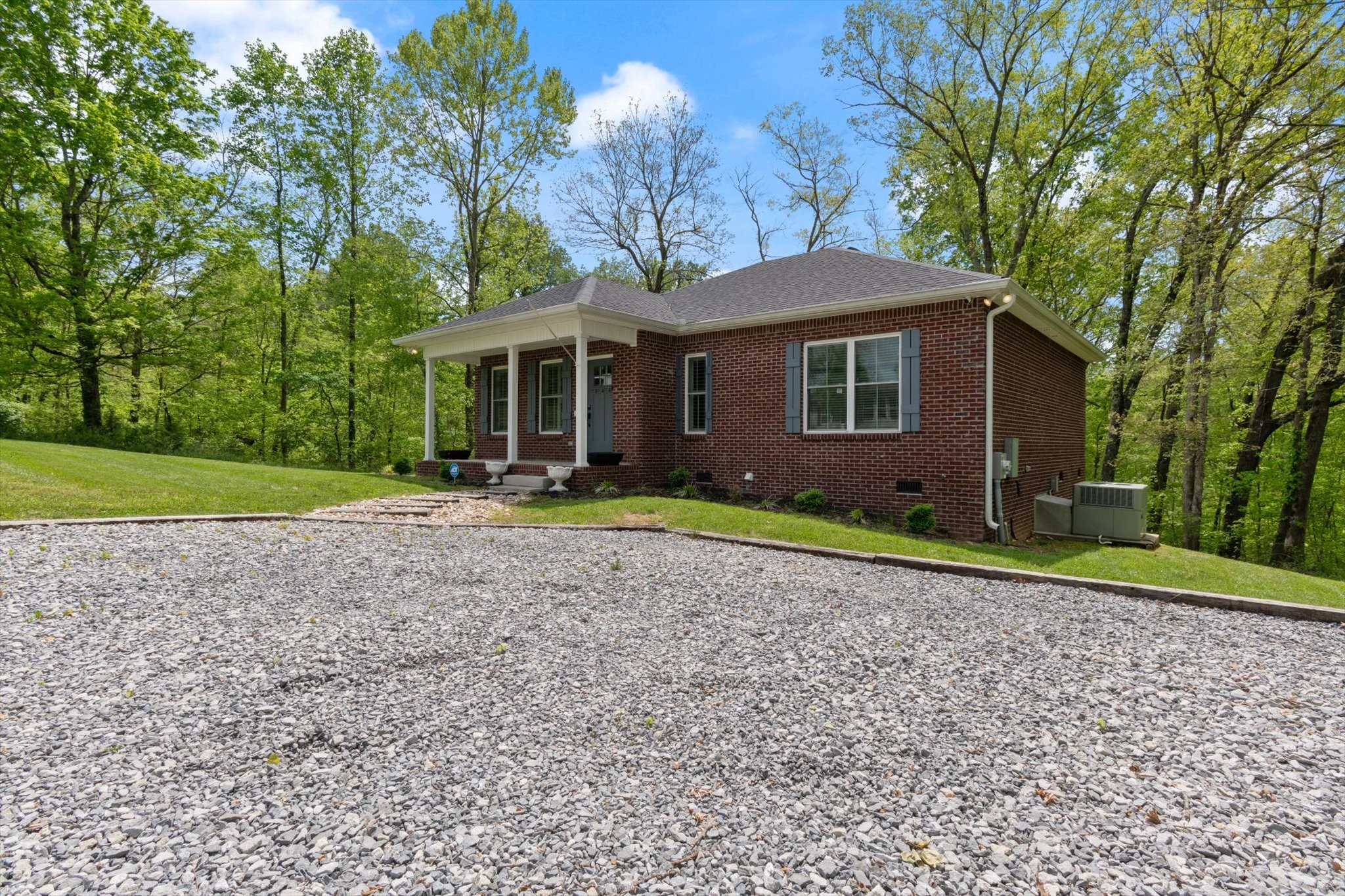 7452 South Swift Road Goodlettsville, TN 37072 - Photo 4 of 27 a view of a house with a yard and large tree
