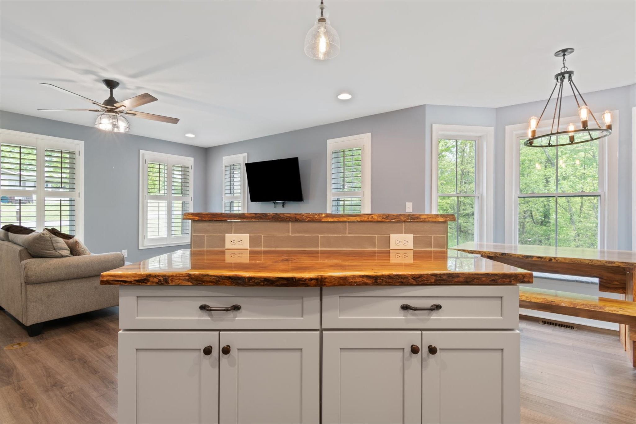 7452 South Swift Road Goodlettsville, TN 37072 - Photo 10 of 27 a living room with kitchen island granite countertop wooden floor and a window