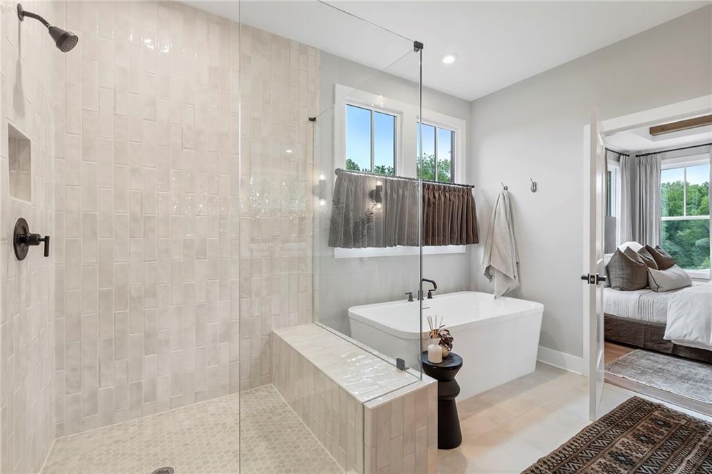 1932 Repose Drive Chamblee, GA 30341 - Photo 13 of 29 a bathroom with a sink a mirror and a shower