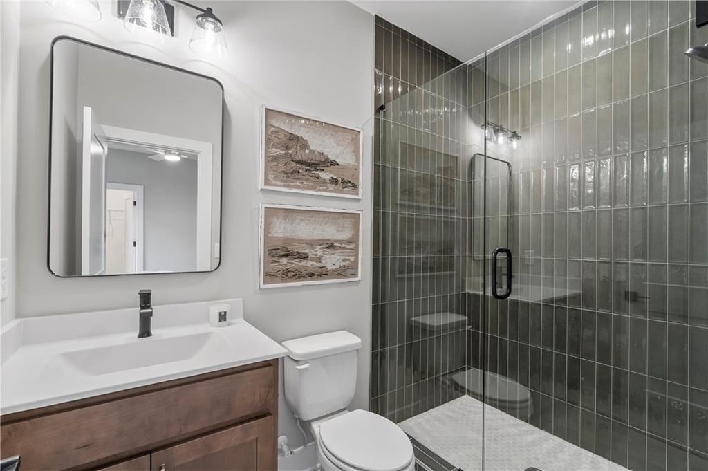 1932 Repose Drive Chamblee, GA 30341 - Photo 16 of 29 a bathroom with a sink toilet and shower