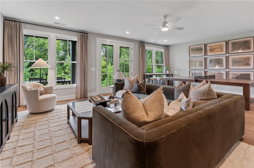 1932 Repose Drive Chamblee, GA 30341 - Photo 24 of 29 a living room with furniture and large windows