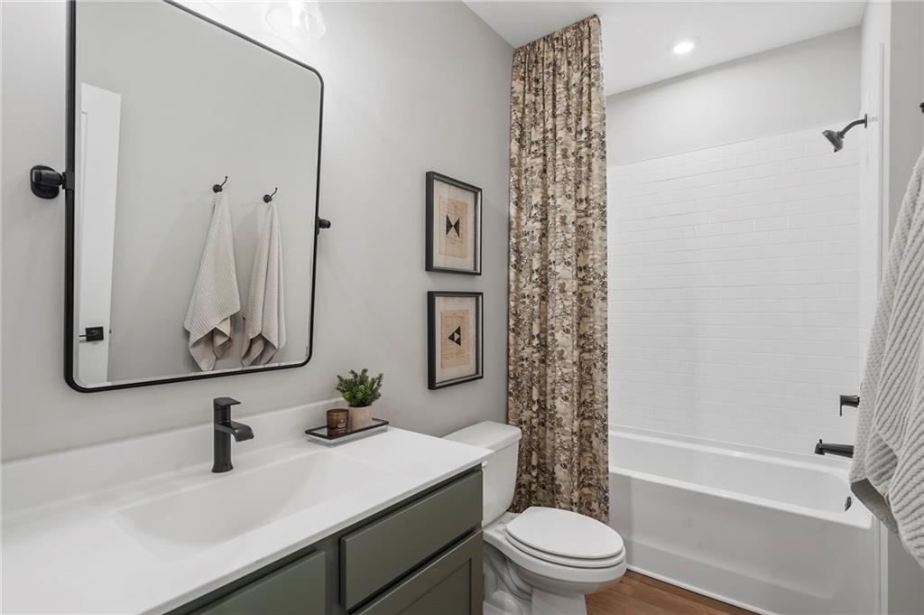 1932 Repose Drive Chamblee, GA 30341 - Photo 27 of 29 a bathroom with a sink a toilet and shower